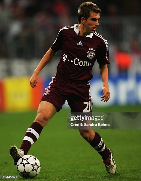 Philipp Lahm of Bayern Munich runs with the ball during the UEFA Champions League Group B match between Bayern Munich and Sporting Lisbon at the...