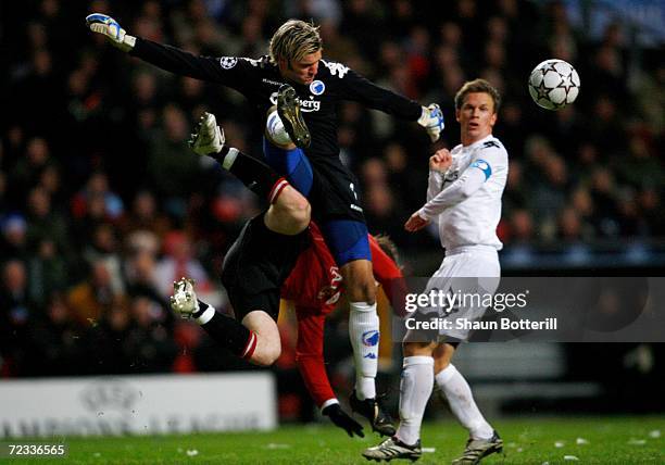 Copenhagen goalkeeper Jesper Christiansen crashes into Wayne Rooney of Manchester United during the UEFA Champions League Group F match between FC...