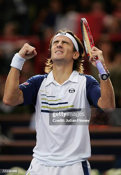 Tommy Robredo of Spain celebrates defeating Sebastein Grosjean of France during day three of the BNP Paribas ATP Tennis Masters Series at the Palais...