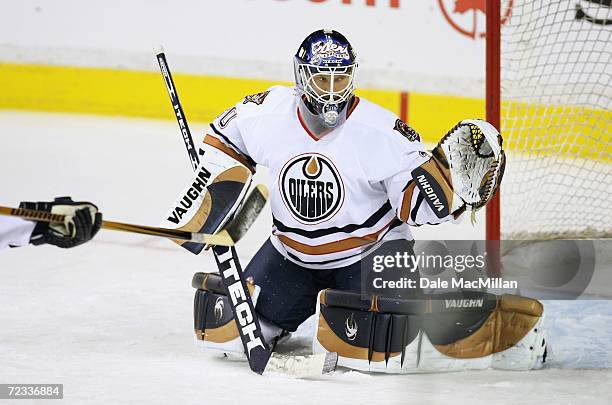 Goaltender Jussi Markkanen of the Edmonton Oilers guards the net against the Calgary Flames at the Pengrowth Saddledome on October 7, 2006 in...