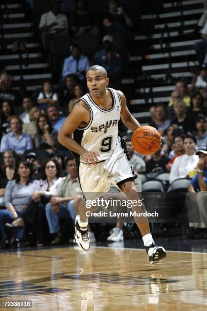 Tony Parker of the San Antonio Spurs dribbles against the Miami Heat during a preseason game at the AT&T Center on October 21, 2006 in San Antonio,...