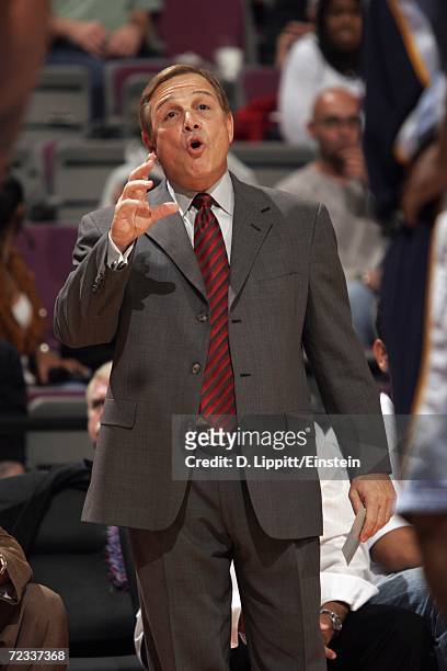 Head coach Mike Fratello of the Memphis Grizzlies relays intructions from the sidelines during a preseason game against the Detroit Pistons at the...