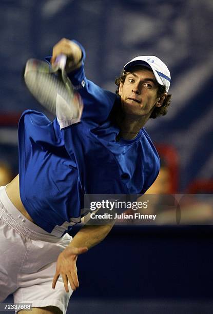 Andy Murray of Great Britain serves to Juan Ignacio Chela of Argentina during day three of the BNP Paribas ATP Tennis Masters Series at the Palais...