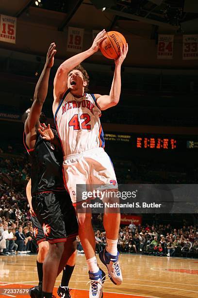 David Lee of the New York Knicks takes the ball to the basket during a preseason game against the Philadelphia 76ers on October 24, 2006 at Madison...