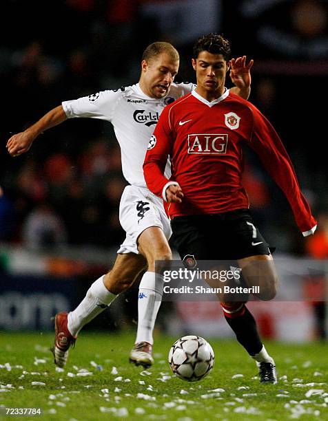 Cristiano Ronaldo of Manchester United gets away from Hjalte Norregaard of FC Copenhagen during the UEFA Champions League Group F match between FC...