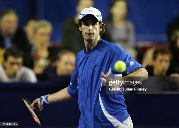 Andy Murray of Great Britain plays a forehand in his match against Juan Ignacio Chela of Argentina during day three of the BNP Paribas ATP Tennis...