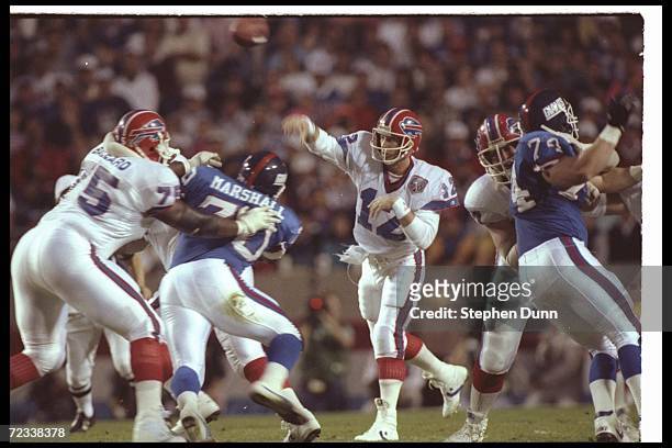 Quarterback Jim Kelly of the Buffalo Bills throws the ball against the New York Giants during Super Bowl XXV at Tampa Stadium in Tampa, Florida. The...