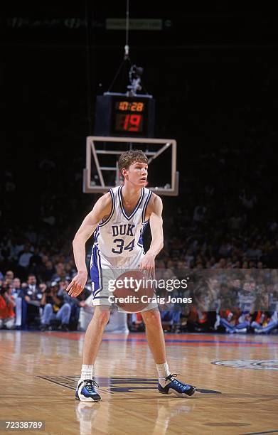 Mike Dunleavy Jr. #34 of the Duke Blue Devils passes the ball during the ACC Tournament against the Maryland Terrapins at the Charlotte Coliseum in...