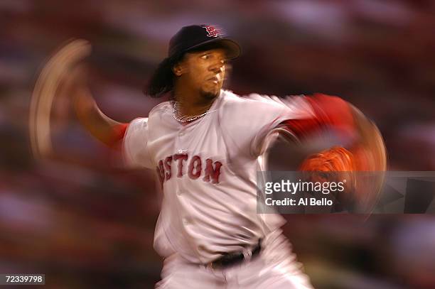 Starting pitcher Pedro Martinez of the Boston Red Sox throws a pitch against the St. Louis Cardinals during the first inning of game three of the...