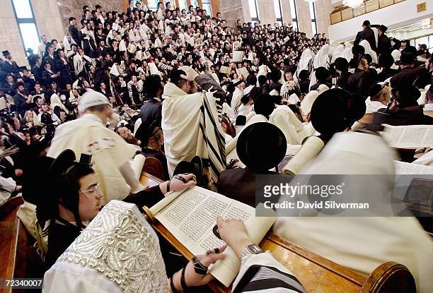 Ultra-Orthodox Jews from the eastern European Vizhnitz sect read from the "Scroll of Esther" February 26, 2002 in their synagogue in Bnei Brak during...