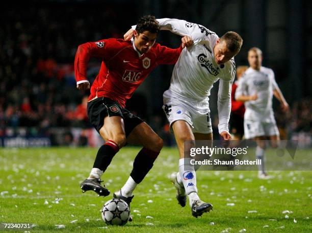 Cristiano Ronaldo of Manchester United battles with Michael Gravgaard of FC Copenhagen during the UEFA Champions League Group F match between FC...