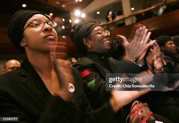 Members of the Black Panther Party applaud Minister Louis Farrakhan, leader of the Nation of Islam, and other national civic, political and religious...