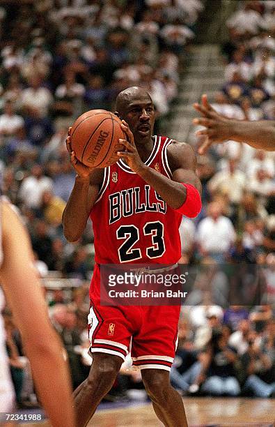 Michael Jordan of the Chicago Bulls looks to pass the ball during game five of the NBA Final against the Utah Jazz at the Delta Center in Salt Lake...