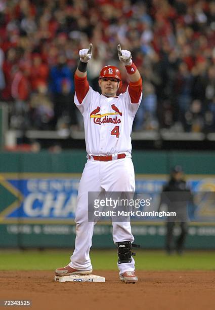 Yadier Molina of the St. Louis Cardinals points to the crowd in celebration during Game Three of the 2006 World Series against the Detroit Tigers on...