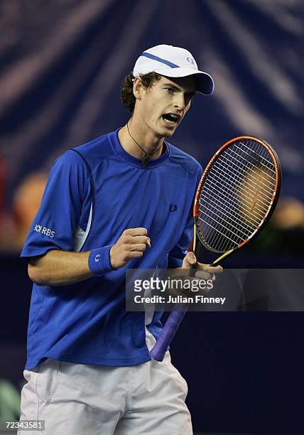 Andy Murray of Great Britain celebrates winning the first set in his match against Juan Ignacio Chela of Argentina during day three of the BNP...