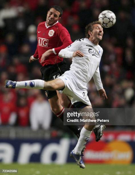 John O'Shea of Manchester United clashes with Michael Silberbauer of FC Copenhagen during the UEFA Champions League match between FC Copenhagen and...