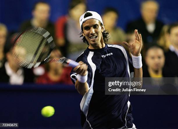 Juan Ignacio Chela of Argentina plays a forehand in his match against Andy Murray of Great Britain during day three of the BNP Paribas ATP Tennis...