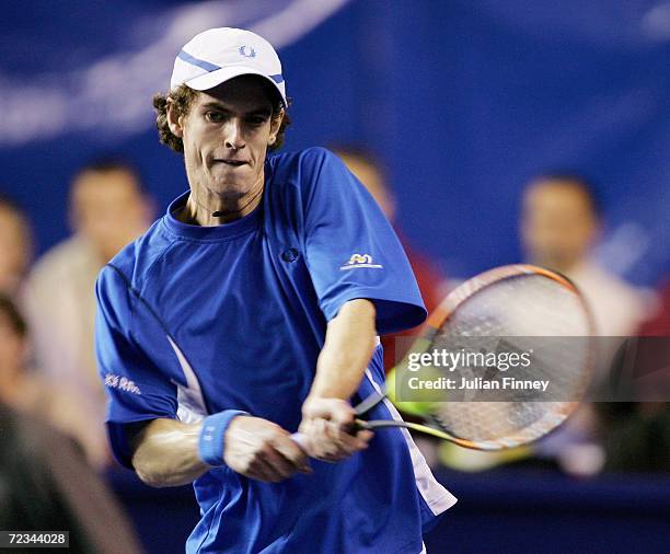 Andy Murray of Great Britain plays a backhand in his match against Juan Ignacio Chela of Argentina during day three of the BNP Paribas ATP Tennis...