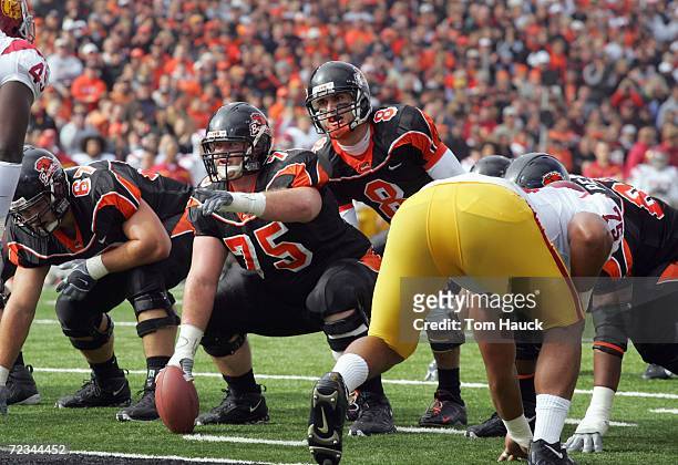 Matt Moore of the Oregon State Beavers readies to hike the ball from center Kyle DeVan during the game against the Southern California Trojans at...