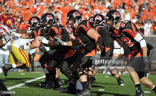 Jeremy Perry, Adam Koets,Brandon Powers of the Oregon State Beavers move on the line during the game against the Southern California Trojans at Reser...