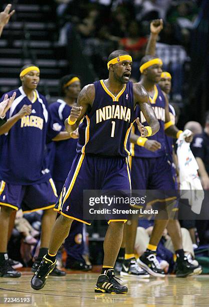 Stephen Jackson of the Indiana Pacers celebrates with teammates after a basket against the Charlotte Bobcats on November 1, 2006 at the Charlotte...