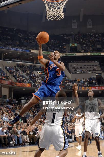 Stephon Marbury of the New York Knicks shoots a layup over Kyle Lowry of the Memphis Grizzlies on November 1, 2006 at FedExForum in Memphis,...
