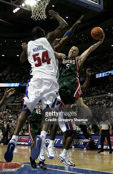 Steve Blake of the Milwaukee Bucks trys to get to the basket past Jason Maxiell of the Detroit Pistons on November 1, 2006 at the Palace of Auburn...