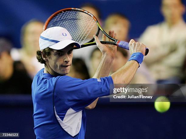 Andy Murray of Great Britain plays a backhand in his match against Juan Ignacio Chela of Argentina during day three of the BNP Paribas ATP Tennis...