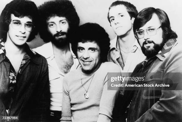 Italian-American singer Frankie Valli with a late line up of The Four Seasons vocal group, circa 1975. Gaudio