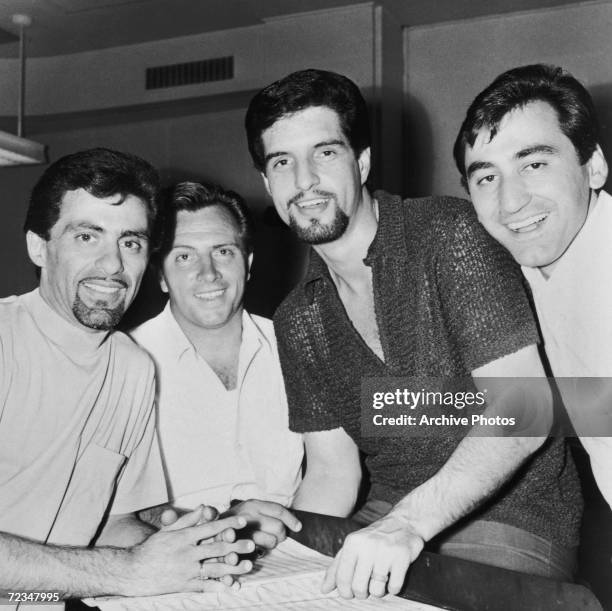 Italian-American vocal group The Four Seasons during a recording session, circa 1966. Left to right: Frankie Valli, Tommy DeVito, Bob Gaudio and Joe...