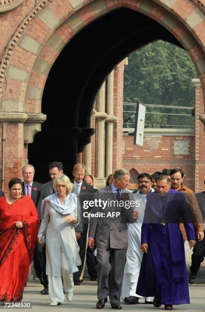 Britain's Prince Charles and his wife Camilla, Duchess of Cornwall , walk with Bishop of Lahore Alexandar Johan Malik and his wife Shamim Malik...