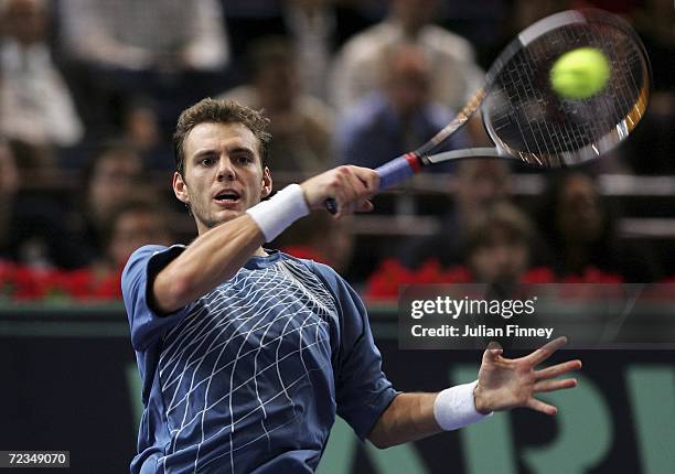 Paul-Henri Mathieu of France plays a forehand against Tommy Robredo of Spain in the third round during day four of the BNP Paribas ATP Tennis Masters...