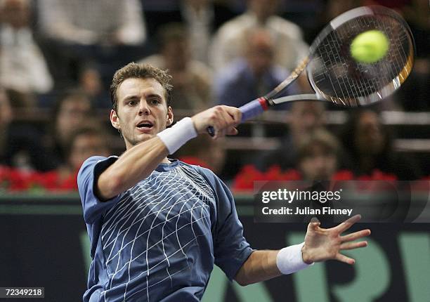 Paul-Henri Mathieu of France plays a forehand in his match against Tommy Robredo of Spain in the third round during day four of the BNP Paribas ATP...