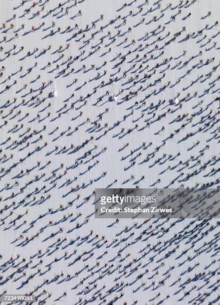 aerial view of skiers on snow covered field - abundance stock pictures, royalty-free photos & images