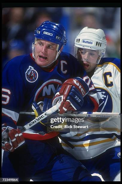 Dec 1992: Rightwinger Patrick Flatley of the New York Islanders works against Pat LaFontaine of the Buffalo Sabres during their game on December 4,...