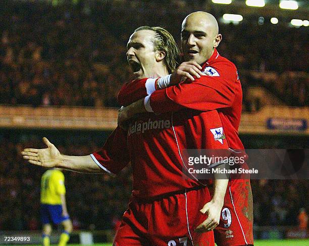 Bolo Zenden of Middlesbrough celebrates with Massimo Maccarone after scoring the first goal during the Carling Cup semi final, second leg match...