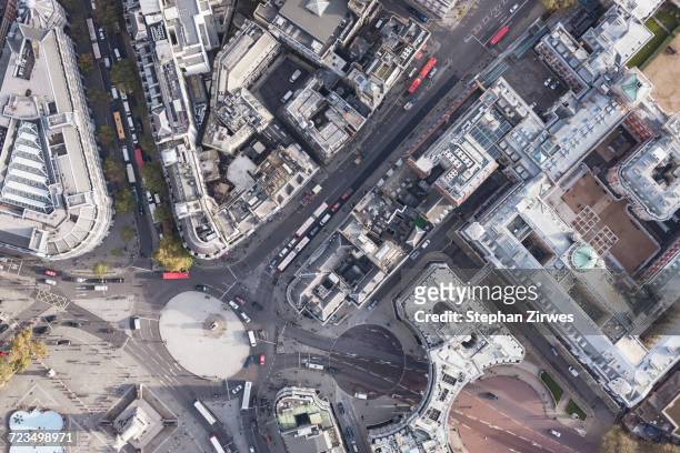 directly above view of traffic circle amongst buildings, london, england, uk - traffic circle stock pictures, royalty-free photos & images