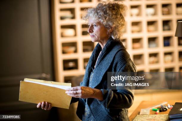 woman in ceramics gallery - pigeon hole stock pictures, royalty-free photos & images