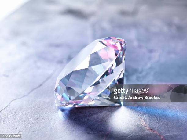 diamond on piece of granite, close-up - diamonds stockfoto's en -beelden