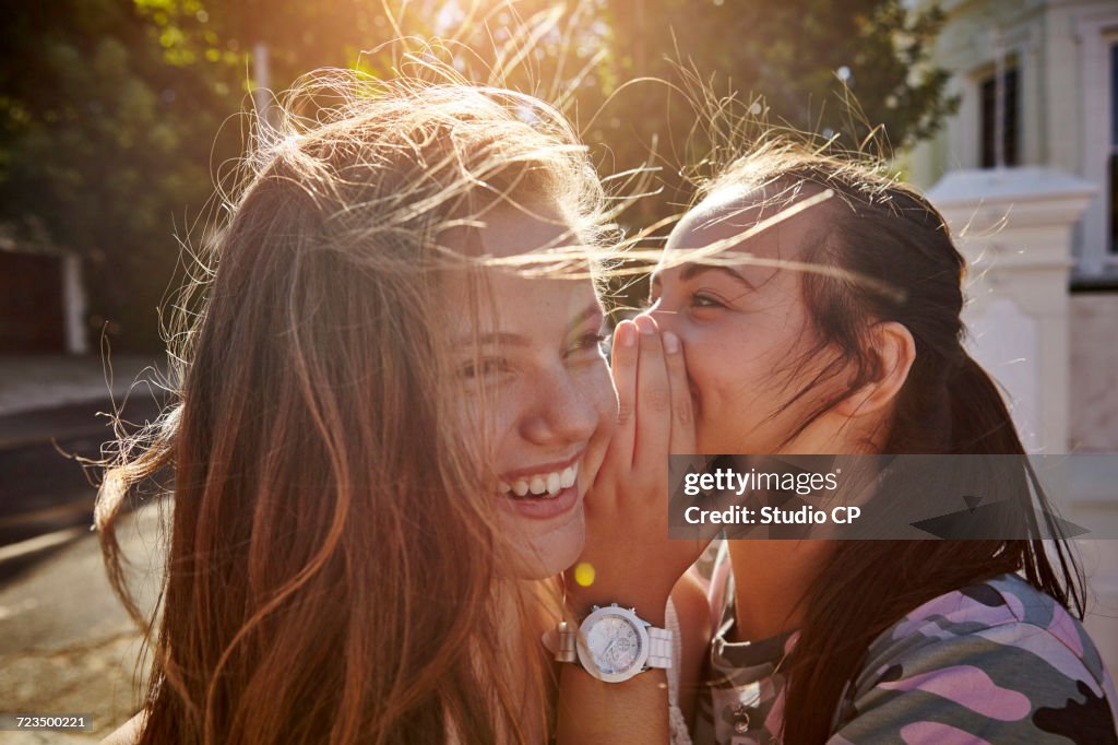 Teenage girls having fun in residential street, Cape Town, South Africa