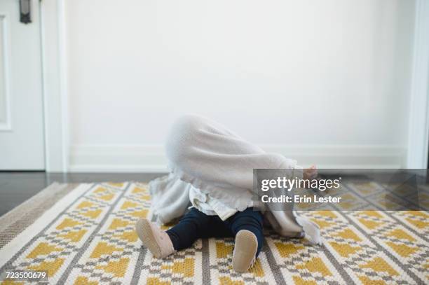 baby girl hiding under blanket - faze rug stock pictures, royalty-free photos & images