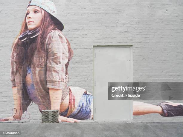 dancer image in cobra pose on grey brick wall - streetart stock pictures, royalty-free photos & images