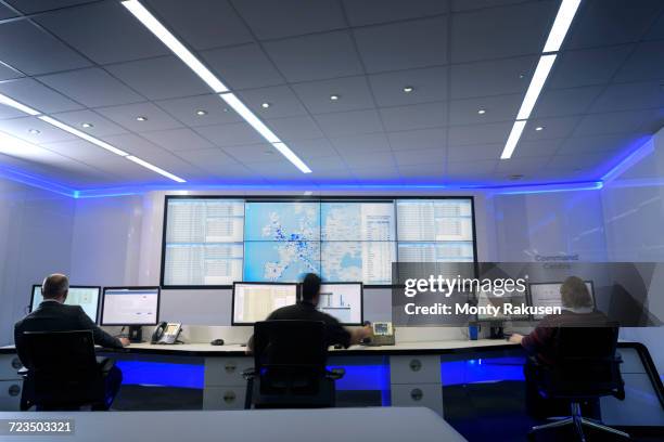 operators in automotive emergency response control room in car factory - control room stockfoto's en -beelden