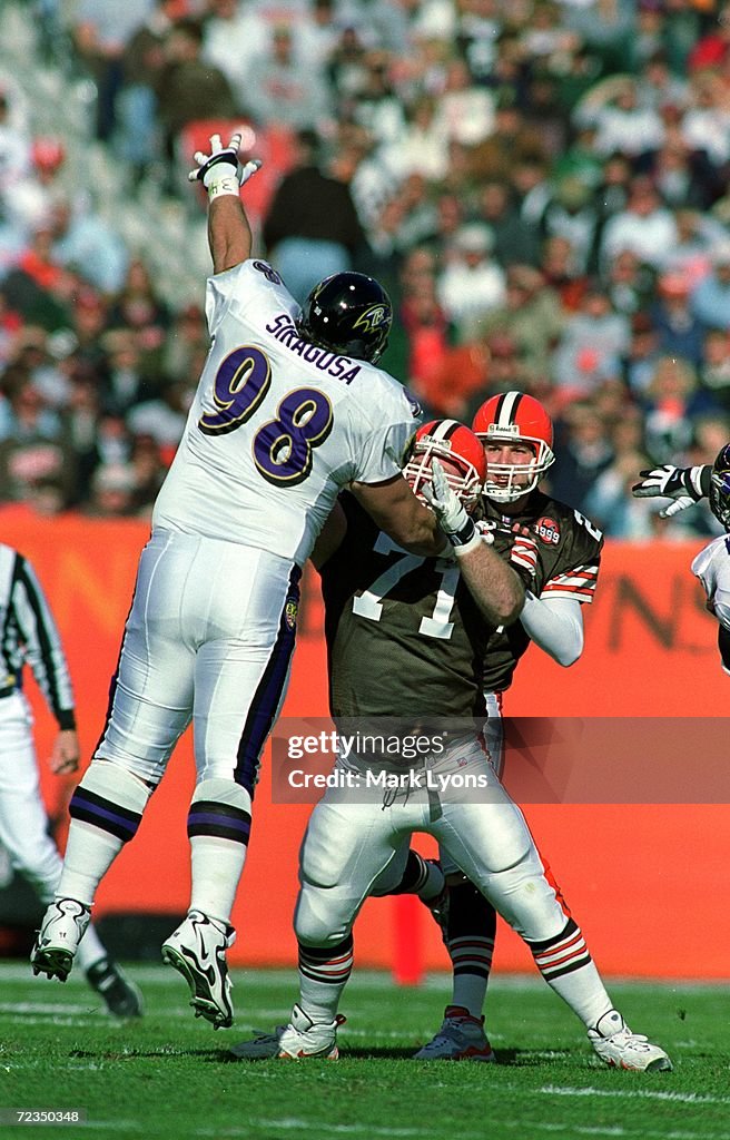 Tony Ragusa Buffalo Tony Siragusa of the Baltimore Ravens jumps to reach for the ball as ...