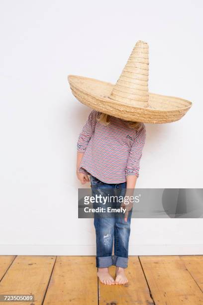 young girl, wearing sombrero, pointing to feet - pointed foot stock pictures, royalty-free photos & images