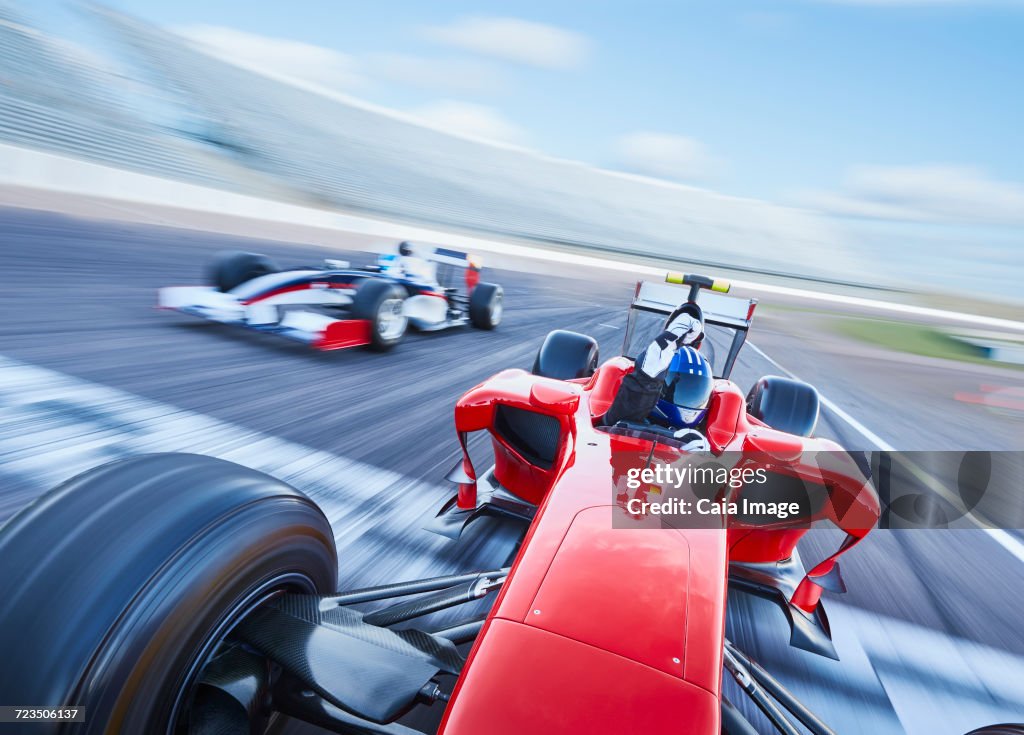 Open-wheel single-seater racing car race car crossing finish line on sports track