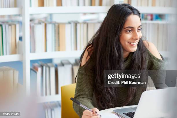 university student working in library - college library stock pictures, royalty-free photos & images