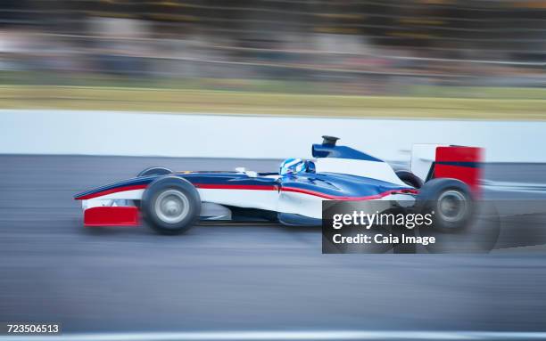 side view open-wheel single-seater racing car race car on sports track - auto racing stock pictures, royalty-free photos & images