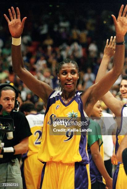 Lisa Leslie of the Los Angeles Sparks celebrates after the WNBA West Conference Finals against the Houston Comets at the Great Western Forum in...