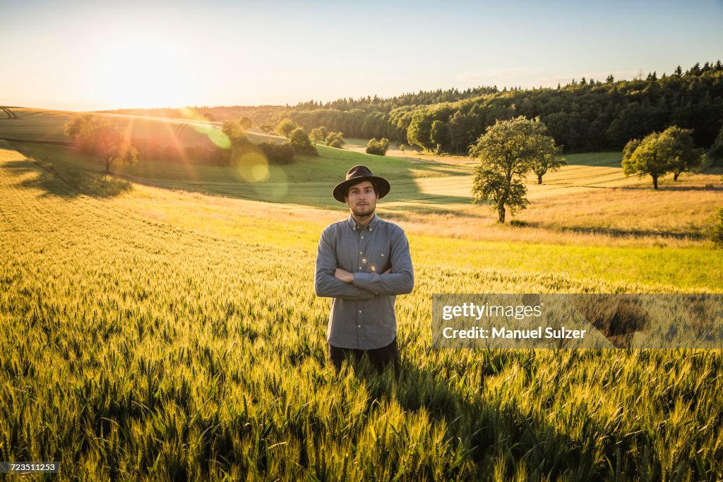 Portrait of mid adult man, standing in field, Neulingen, Baden-Wrttemberg, Germany